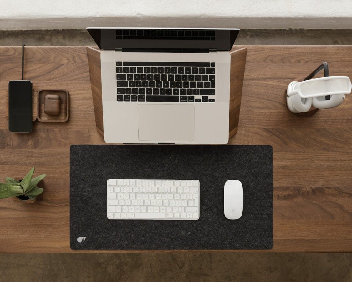 Photo by Mateusz Haberny a laptop computer sitting on top of a wooden desk