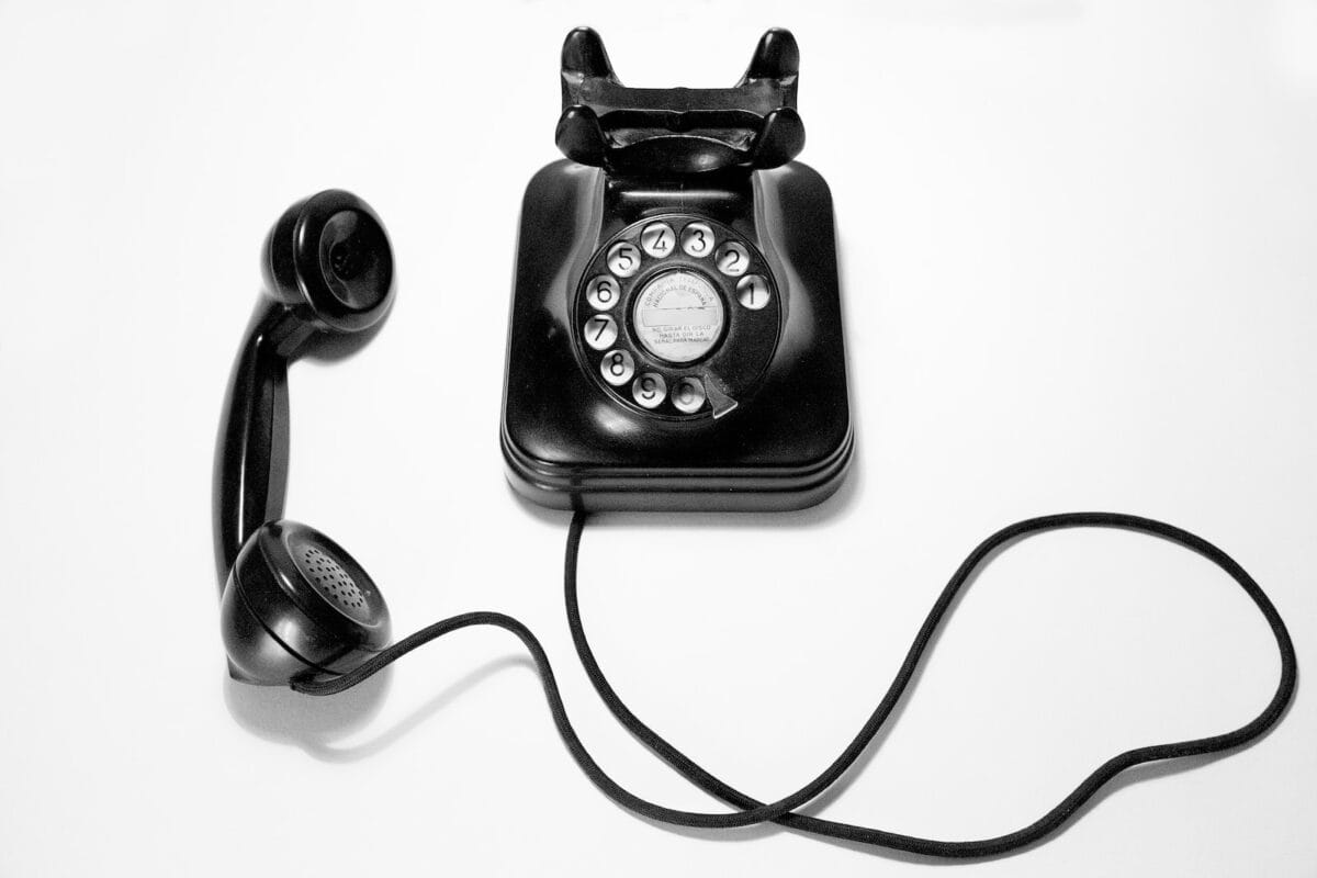 Photo by Quino Al black rotary dial phone on white surface