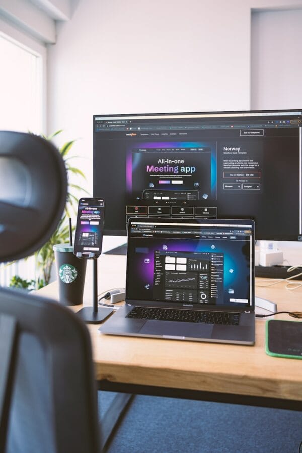 Photo by Azwedo L.LC a desk with a laptop and a monitor on it