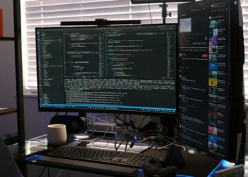 a computer monitor sitting on top of a desk