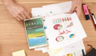 person holding white Samsung Galaxy Tab