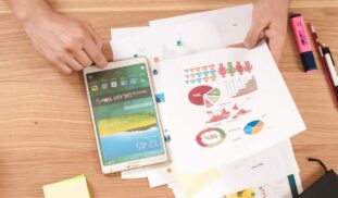 person holding white Samsung Galaxy Tab