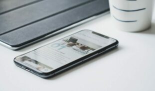 black smartphone beside black smart case