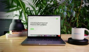 a laptop computer sitting on top of a wooden table