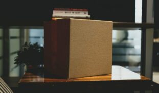 brown box on wooden surface
